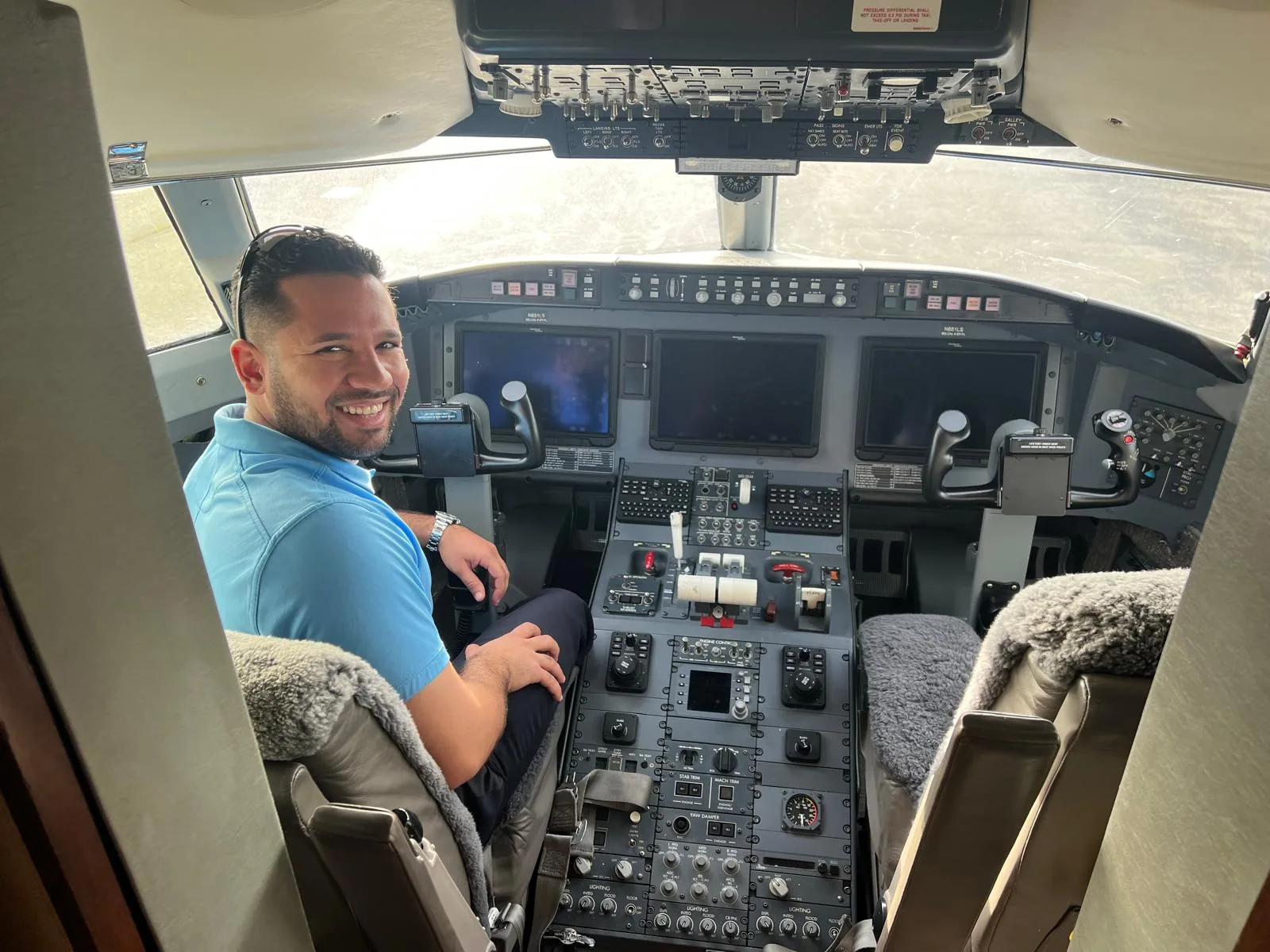 Pilot seated in a business aircraft cockpit