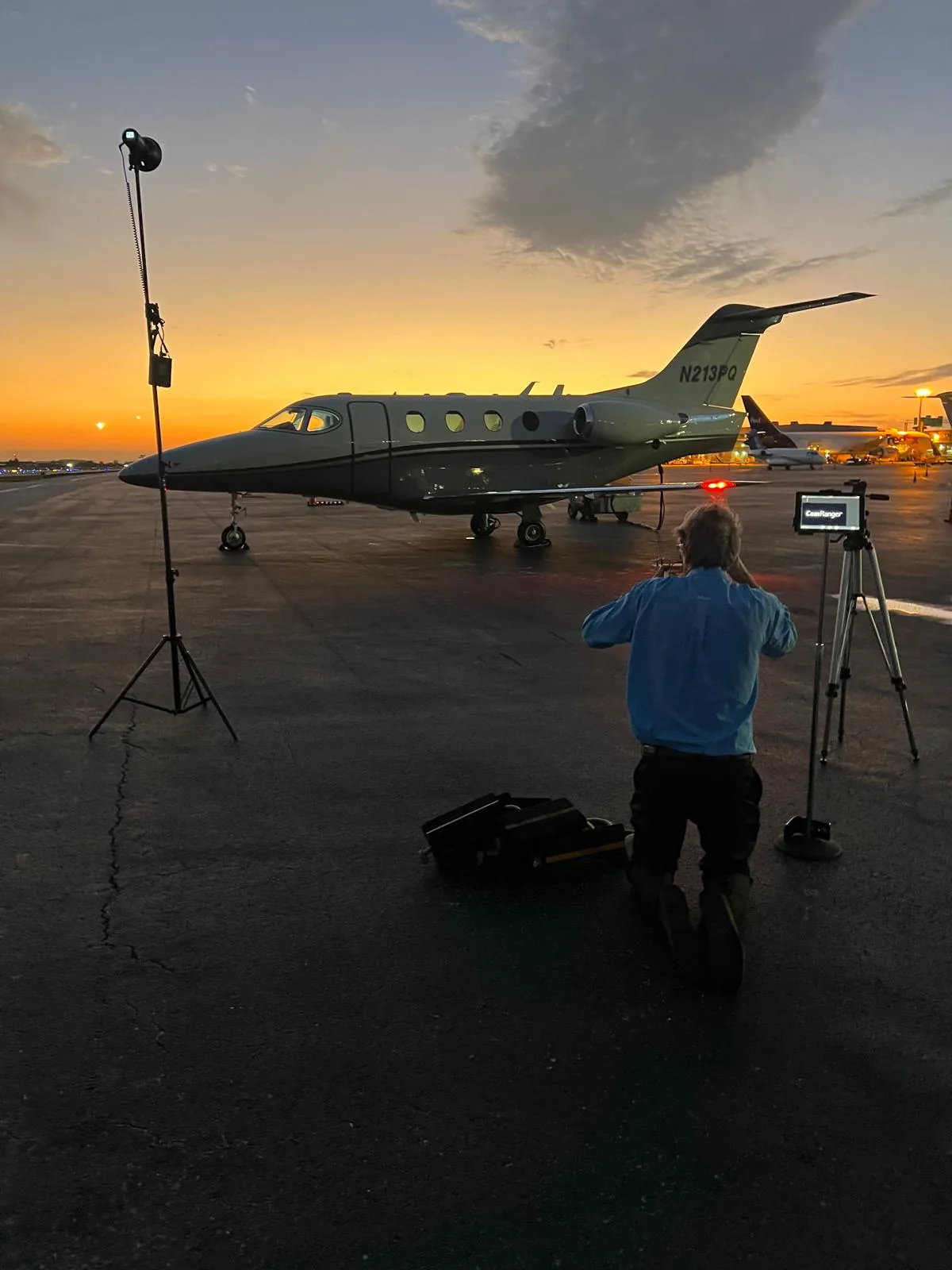 Business aircraft photographed on the ramp at sunset